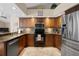 Fully equipped kitchen with stainless steel appliances, granite counters and tile backsplash at 4311 W Beach Park Dr, Tampa, FL 33609