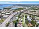 Stunning aerial view of a residential area with a community pool, waterway, and easy access to beaches and the bay at 4694 Huron Rd, St Petersburg, FL 33708
