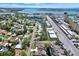Aerial view of neighborhood showcasing the surrounding streets, landscaping, and nearby waterfront at 4694 Huron Rd, St Petersburg, FL 33708