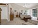 Cozy bedroom with ample natural light, neutral walls, and comfortable furnishings at 4694 Huron Rd, St Petersburg, FL 33708