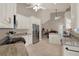 Bright kitchen with stainless steel appliances and granite counters open to the dining area at 4694 Huron Rd, St Petersburg, FL 33708