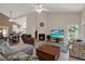 Bright and open living room with high ceilings, fireplace, and comfortable seating at 4694 Huron Rd, St Petersburg, FL 33708