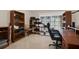 Office space with a desk, shelving, and a comfortable chair, perfect for working from home at 4694 Huron Rd, St Petersburg, FL 33708