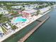Aerial view showcasing a pool and community center along the water at 5012 Starfish Se Dr # B, St Petersburg, FL 33705
