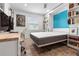 Murphy bed in a room with wood-look tile, ceiling fan, desk, and decor at 5012 Starfish Se Dr # B, St Petersburg, FL 33705