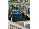 A private boat lift on a sunny day near the water, and the lifts are reflecting in the water at 5012 Starfish Se Dr # B, St Petersburg, FL 33705