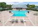 An overhead shot shows a community pool with lounge chairs and tropical landscaping, creating a relaxing oasis at 5012 Starfish Se Dr # B, St Petersburg, FL 33705