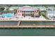 Aerial view of a waterfront condo building with a community pool and a private dock at 5012 Starfish Se Dr # B, St Petersburg, FL 33705