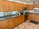 The kitchen features ample counter space, stainless steel appliances, and honey toned cabinets at 5012 Starfish Se Dr # B, St Petersburg, FL 33705