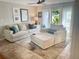 Bright living room with comfortable seating, modern decor, and sliding glass doors to the outside at 5012 Starfish Se Dr # B, St Petersburg, FL 33705