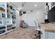 Room with built in storage, desk, rocker, and wood-look tile at 5012 Starfish Se Dr # B, St Petersburg, FL 33705