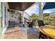 Relaxing patio with a comfortable seating area, an outdoor dining area, and a ceiling fan at 5012 Starfish Se Dr # B, St Petersburg, FL 33705