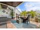 Inviting outdoor patio features a comfortable seating area, lush landscaping, and stairs to the deck at 5012 Starfish Se Dr # B, St Petersburg, FL 33705
