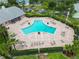 Aerial view of a large community pool surrounded by lounge chairs and lush landscaping at 5012 Starfish Se Dr # B, St Petersburg, FL 33705