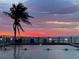 Beautiful sunset at a community pool near the ocean and beach at 5012 Starfish Se Dr # B, St Petersburg, FL 33705