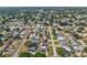 An aerial shot shows the neighborhood, featuring the home's location and proximity to local amenities at 5812 52Nd N Ave, Kenneth City, FL 33709