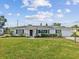 Charming single-story home featuring a well-manicured lawn and beautiful landscaping at 5812 52Nd N Ave, Kenneth City, FL 33709