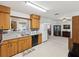 Bright and airy kitchen featuring light wood cabinets and an open design at 5812 52Nd N Ave, Kenneth City, FL 33709