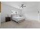 Bright bedroom with neutral paint, carpet, ceiling fan, and large bed at 6281 Dry Tortugas Dr, Sarasota, FL 34241