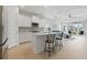 Open-concept kitchen with center island, stainless steel appliances, and adjacent living area at 6281 Dry Tortugas Dr, Sarasota, FL 34241