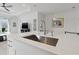 Quartz kitchen island with stainless steel sink and pendant lighting at 6281 Dry Tortugas Dr, Sarasota, FL 34241
