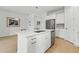 Kitchen island with quartz countertops, stainless steel appliances, and ample storage at 6281 Dry Tortugas Dr, Sarasota, FL 34241