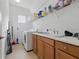 Functional laundry room equipped with modern appliances, ample storage, and a convenient utility sink at 6281 Dry Tortugas Dr, Sarasota, FL 34241