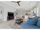 Open concept living room showcasing kitchen island, and modern furniture at 6281 Dry Tortugas Dr, Sarasota, FL 34241