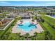 Aerial view of community pool with large deck, pavilion, and playground area at 6281 Dry Tortugas Dr, Sarasota, FL 34241