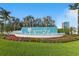 Grand Park community entrance sign with colorful flowers and fountain feature at 6281 Dry Tortugas Dr, Sarasota, FL 34241