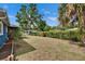 Spacious backyard with lush green grass, perfect for outdoor activities and relaxation at 6409 N 23Rd St, Tampa, FL 33610