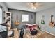 This bedroom is outfitted with shelving, three guitars, a window and a drumset at 6409 N 23Rd St, Tampa, FL 33610