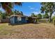Well-maintained single-story home with tidy landscaping, painted in blue at 6409 N 23Rd St, Tampa, FL 33610