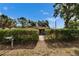 A quaint single-story home is adorned with a lovely green hedge and welcoming walkway at 6409 N 23Rd St, Tampa, FL 33610