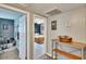 Hallway view to bedroom with neutral walls and access to a music room at 6409 N 23Rd St, Tampa, FL 33610