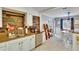 Bright kitchen featuring stainless steel appliances, granite countertops, and wood backsplash wall at 6409 N 23Rd St, Tampa, FL 33610