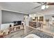 Open living space with a breakfast bar that opens to the living room at 6409 N 23Rd St, Tampa, FL 33610