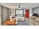 Living room with a plush sectional sofa, wood floors, and a cozy ambiance at 6409 N 23Rd St, Tampa, FL 33610