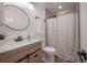 Bathroom showcasing a stylish vanity, modern fixtures, and a shower-tub combination at 6504 N 13Th St, Tampa, FL 33604