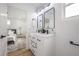 Bright bathroom featuring a double vanity and black fixtures at 6504 N 13Th St, Tampa, FL 33604