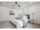 Relaxing bedroom with neutral decor, decorative rug, and matching end tables at 6504 N 13Th St, Tampa, FL 33604