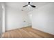Minimalist bedroom featuring wood floors and white walls at 6504 N 13Th St, Tampa, FL 33604