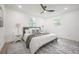 Bedroom with a modern bed and white nightstands at 6504 N 13Th St, Tampa, FL 33604