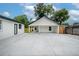 Spacious covered parking featuring a connected carport and large driveway at 6504 N 13Th St, Tampa, FL 33604