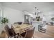 Open concept dining and kitchen area, perfect for entertaining, with modern decor and plenty of light at 6504 N 13Th St, Tampa, FL 33604