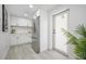 Kitchen features stainless steel appliances and white cabinetry at 6504 N 13Th St, Tampa, FL 33604