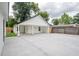 Wide driveway with a detached garage for covered parking at 6504 N 13Th St, Tampa, FL 33604