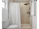 Bathroom showcasing a shower stall with a rainfall shower head and clean white accents at 6504 N 13Th St, Tampa, FL 33604