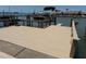 Waterfront dock featuring a boat lift and ample space for entertaining with stunning views at 651 Boca Ciega Point S Blvd, St Petersburg, FL 33708
