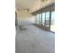 Spacious sunroom with tiled floor and many windows providing ample natural light and water views at 651 Boca Ciega Point S Blvd, St Petersburg, FL 33708